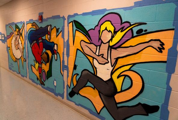 modern dancer painting in hallway