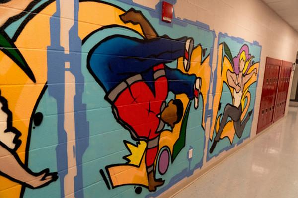 break dancer painting in hallway